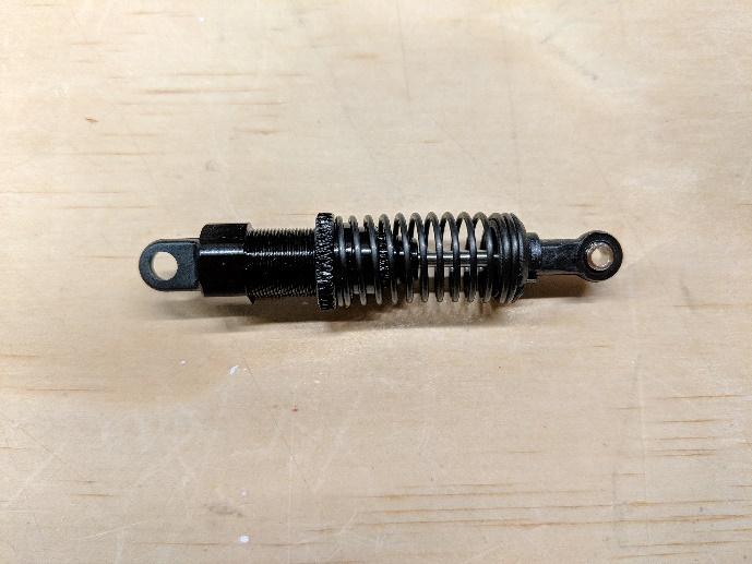 Shock absorber spring adjusted to stiffest position
