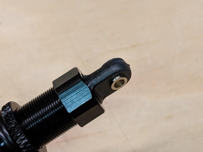 Short ball links installed on the shock absorber ends