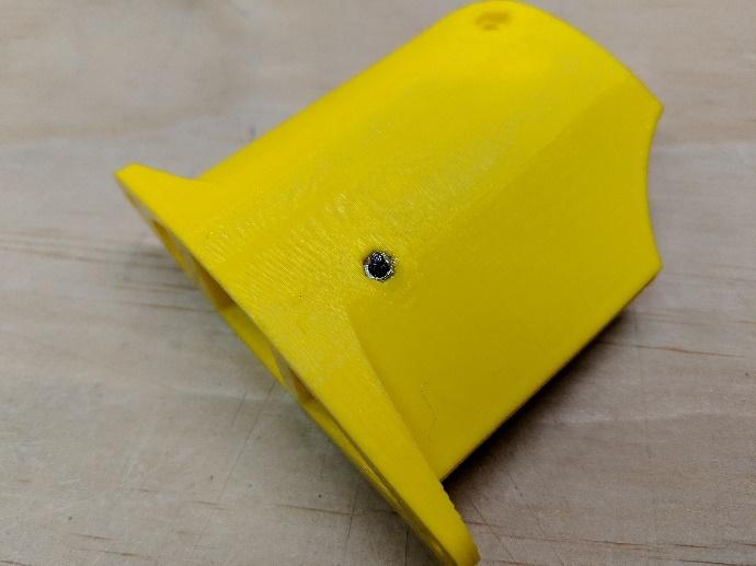 Shock absorber secured with an M2 bolt and nut
