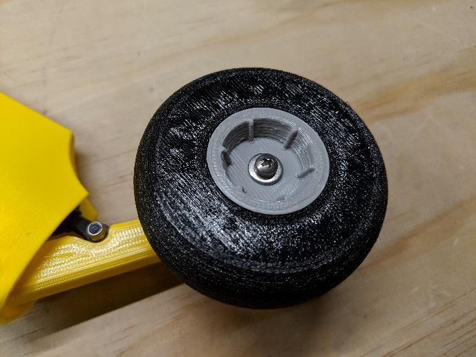 Main wheel positioned on the strut
