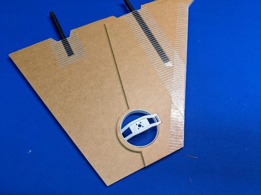 Roll thruster housing, wing cutout