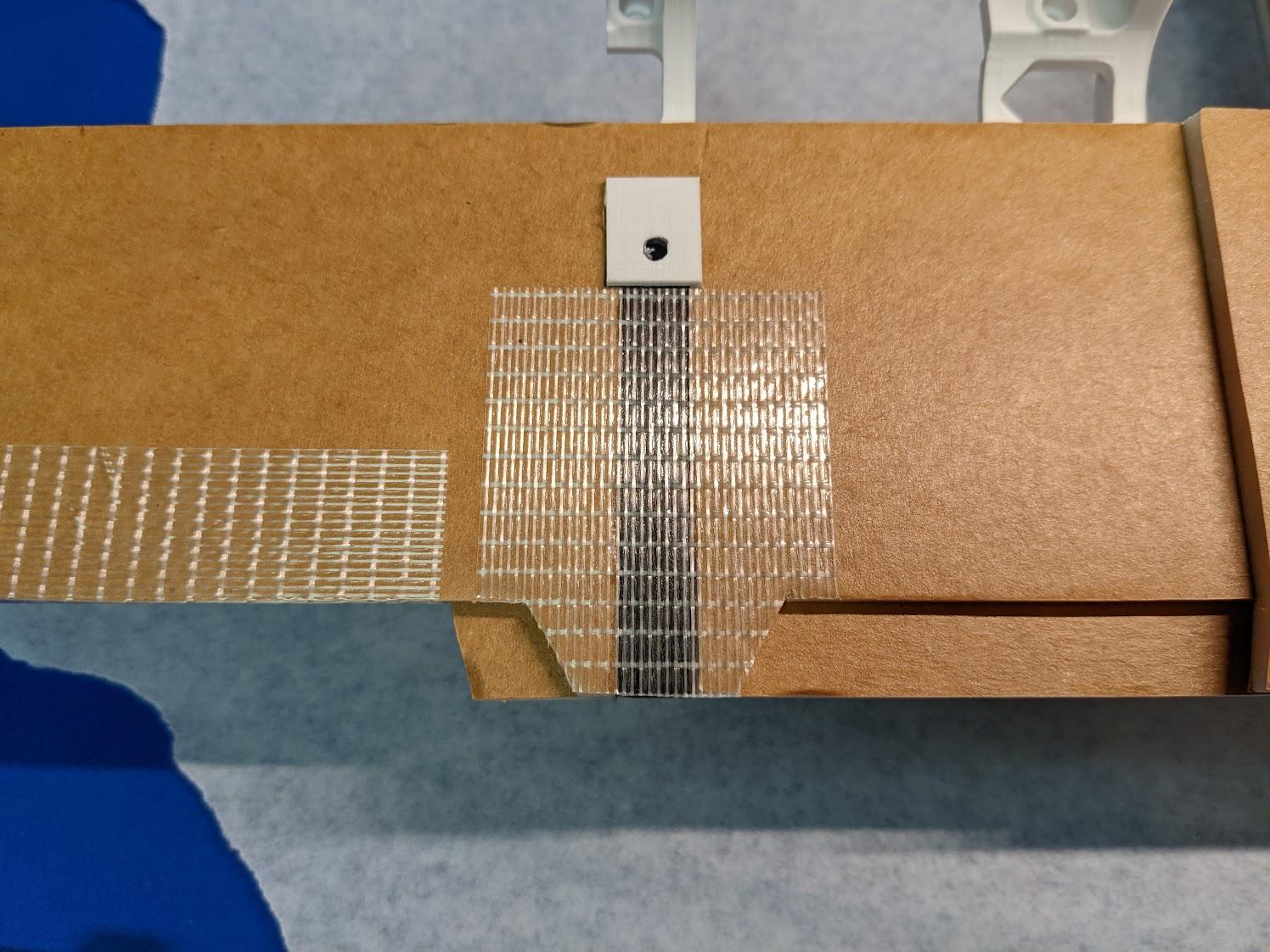 Rear spar receptacles taped