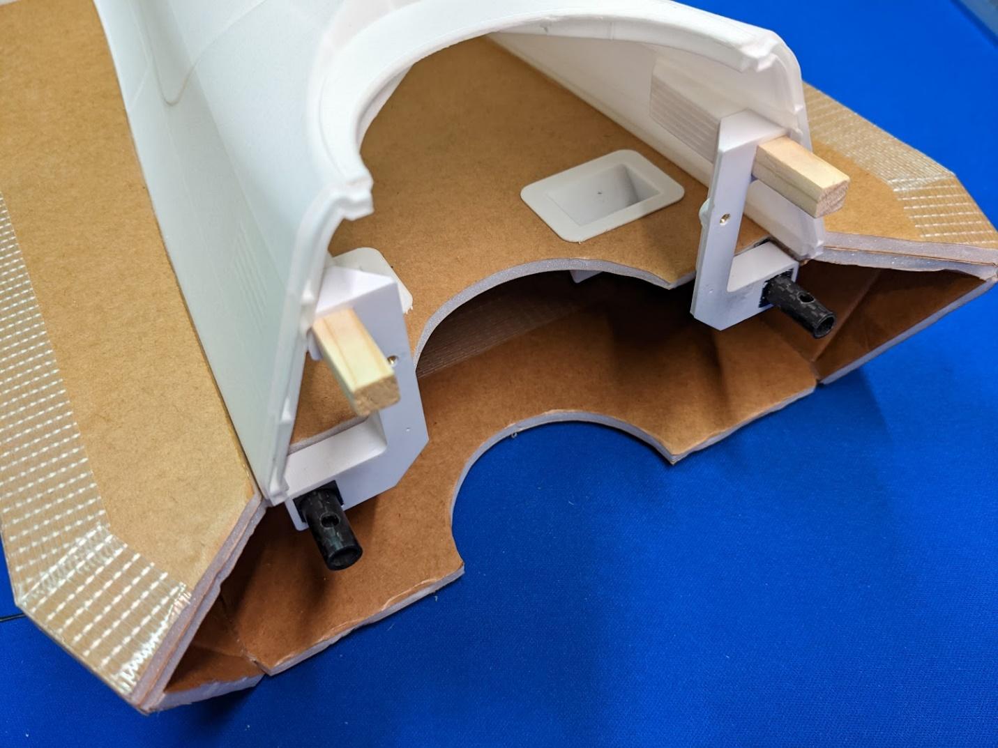 Lift fan mounts slid onto the spars