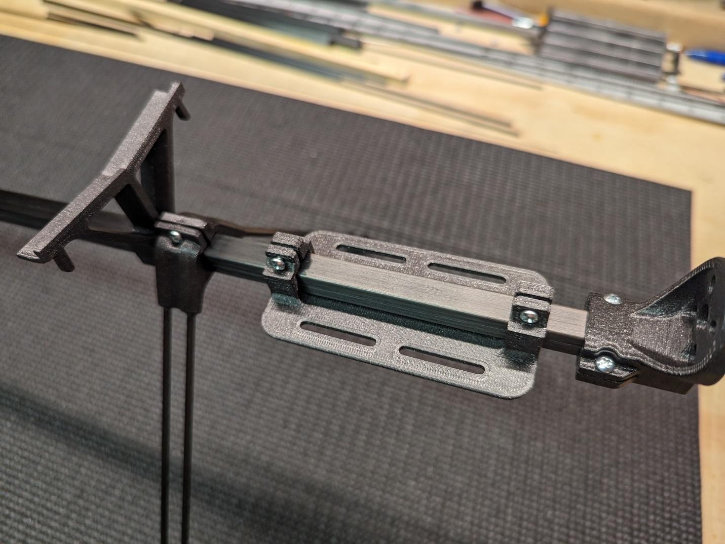 Clamp mounts tightened with tapping screws