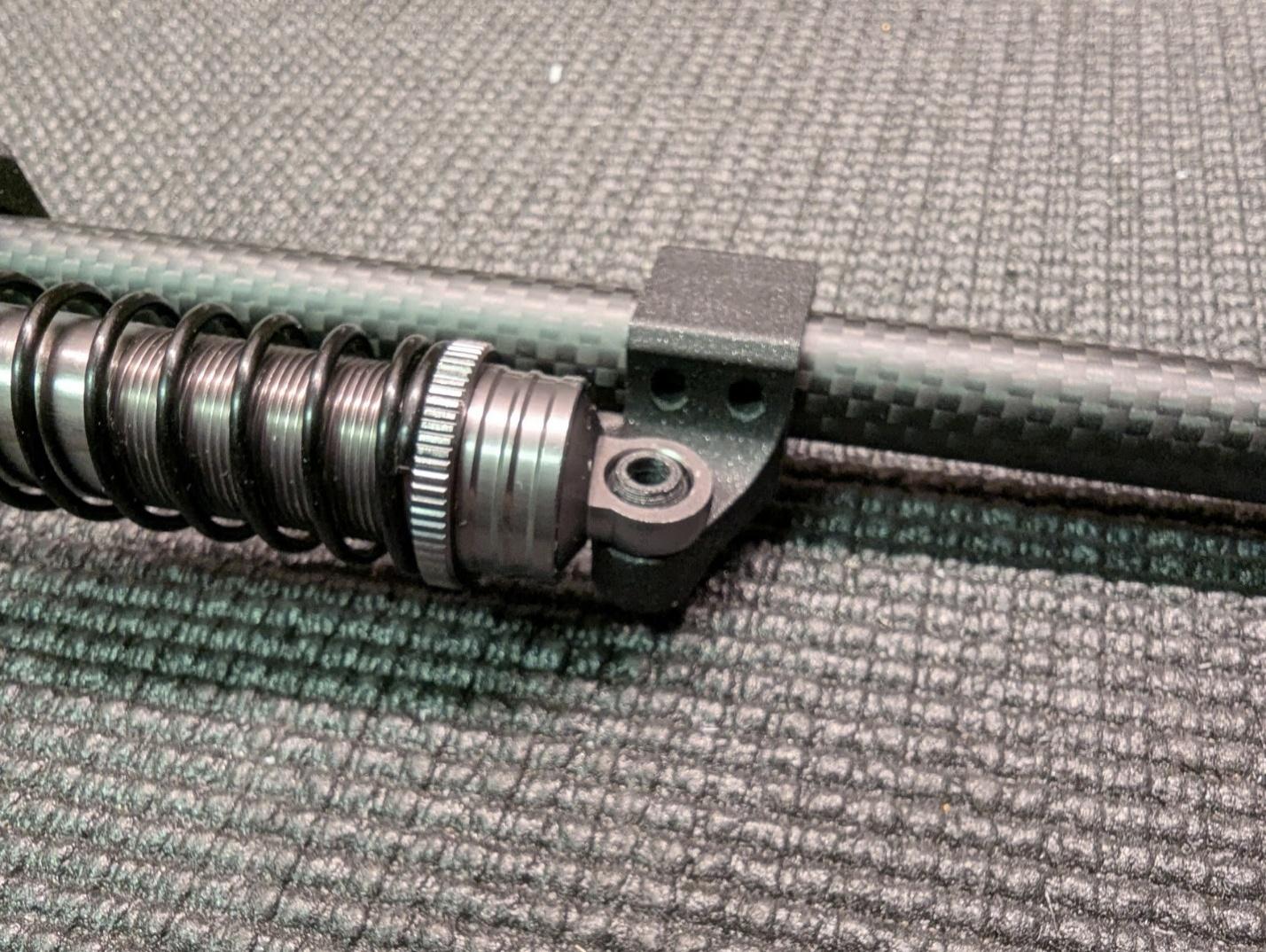 Spacer balls in the shock absorber eye