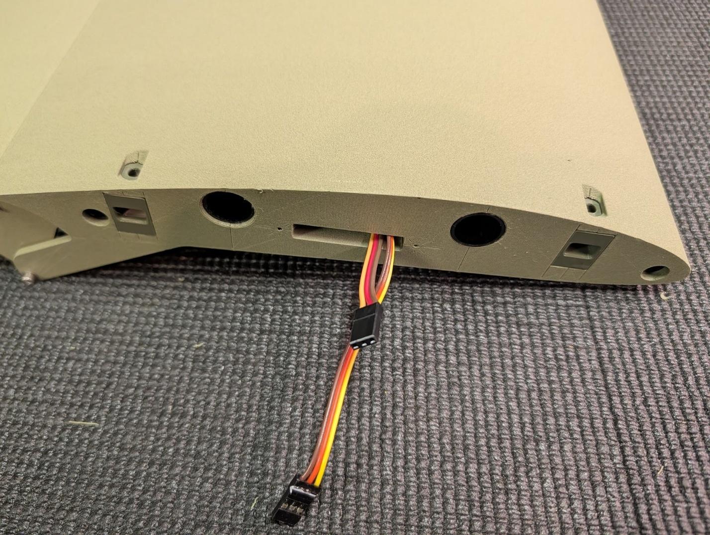 Bolt latch receptacles glued into the wing root
