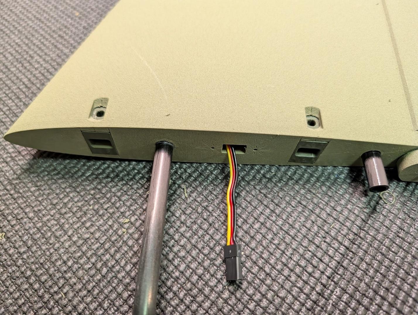 Bolt latch receptacles in the tail root