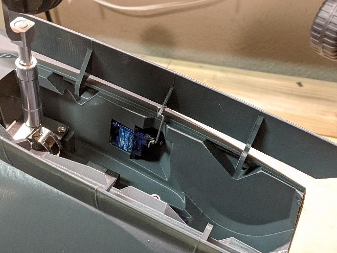 Control arm connected to the nose gear door servo