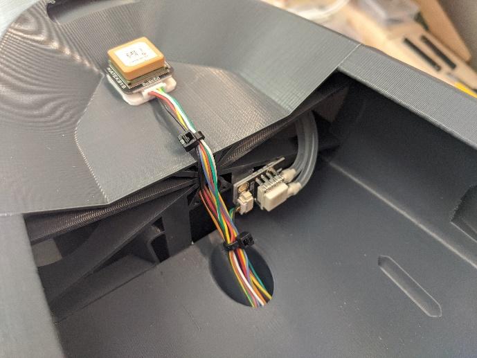 GPS module mounted with excess wiring secured