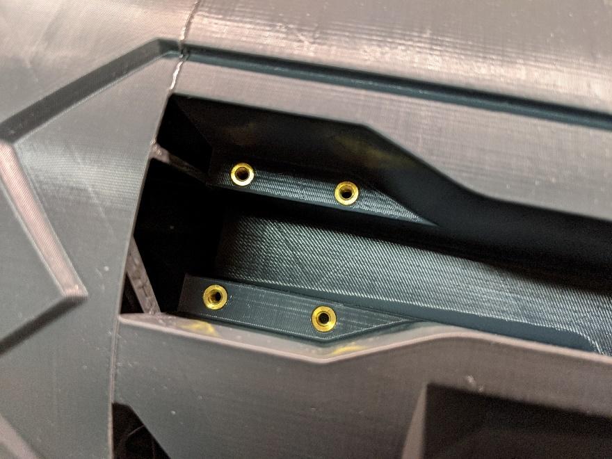 Threaded inserts at the nose retract mount