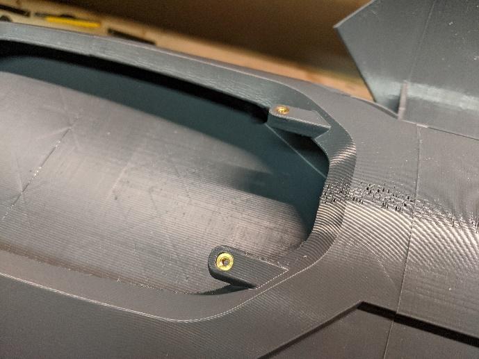 Threaded inserts on the avionics hatch mount tabs
