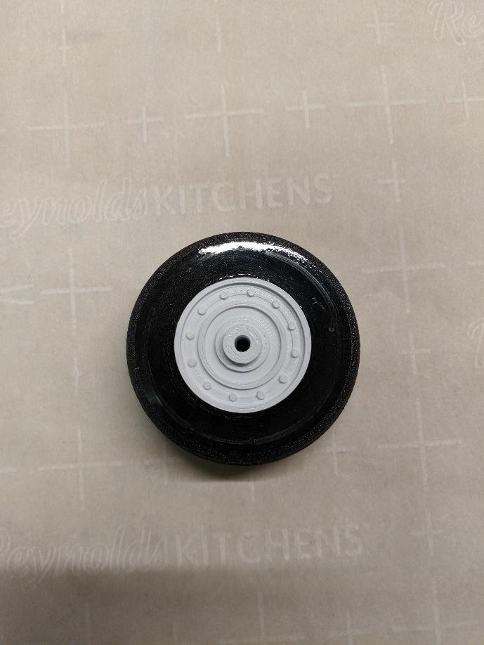 Wheel hub glued together inside the tire
